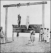 revolutionaries being hanged by the British  soldiers